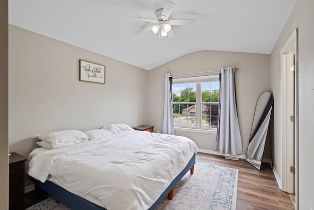 5010 Aspen Ridge Dr, Columbia, MO 65202 - bedroom featuring vaulted ceiling, wood finished floors, and a ceiling fan
