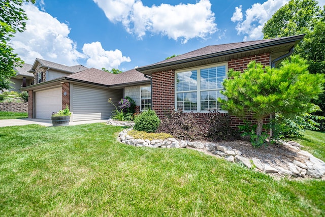 4504 Orrine St, Columbia, MO 65201 - ranch-style home with brick siding, a garage, a front lawn, and concrete driveway