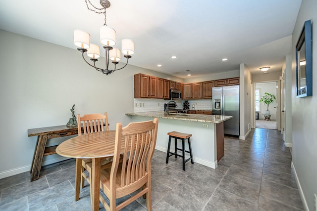 4504 Orrine St, Columbia, MO 65201 - dining space with a chandelier and recessed lighting