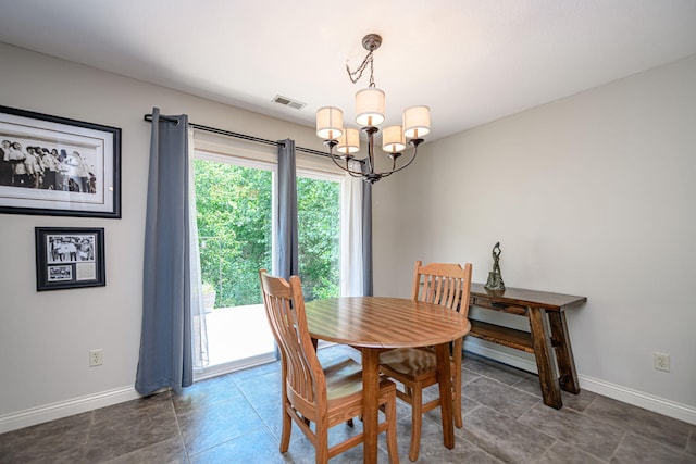 4504 Orrine St, Columbia, MO 65201 - tiled dining space with a chandelier and baseboards