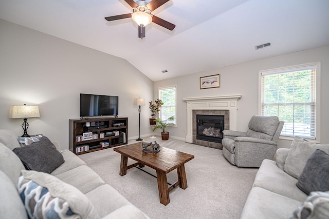 4504 Orrine St, Columbia, MO 65201 - living area with a ceiling fan, light colored carpet, a tile fireplace, and vaulted ceiling