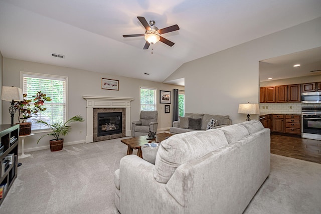 4504 Orrine St, Columbia, MO 65201 - living area with ceiling fan, light carpet, a fireplace, vaulted ceiling, and recessed lighting