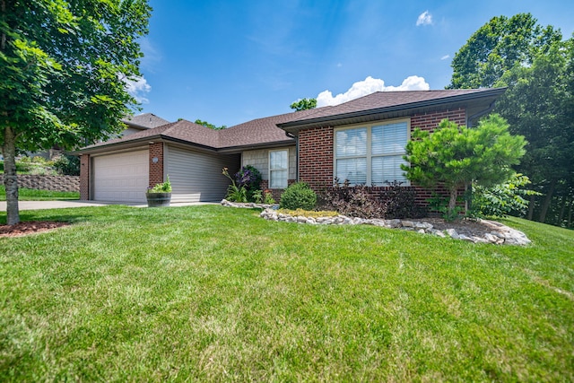 4504 Orrine St, Columbia, MO 65201 - ranch-style home with brick siding, an attached garage, a front yard, and concrete driveway