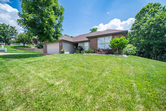 4504 Orrine St, Columbia, MO 65201 - ranch-style home featuring brick siding, a garage, a front yard, and roof with shingles
