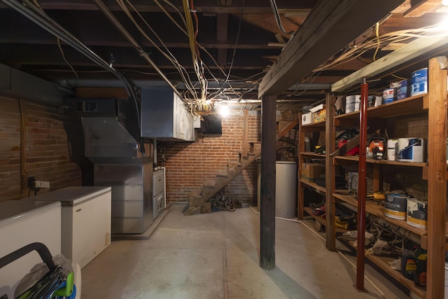 1001 Randolph St, Glasgow, MO 65254 - unfinished below grade area with brick wall and stairs