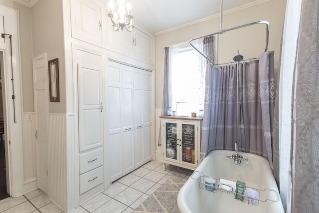 1001 Randolph St, Glasgow, MO 65254 - full bathroom with ornamental molding, a tub to relax in, a chandelier, and tile patterned flooring