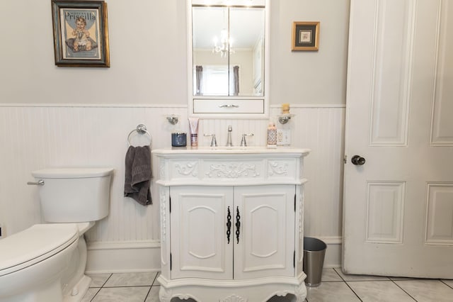 1001 Randolph St, Glasgow, MO 65254 - bathroom featuring wainscoting, tile patterned flooring, and vanity