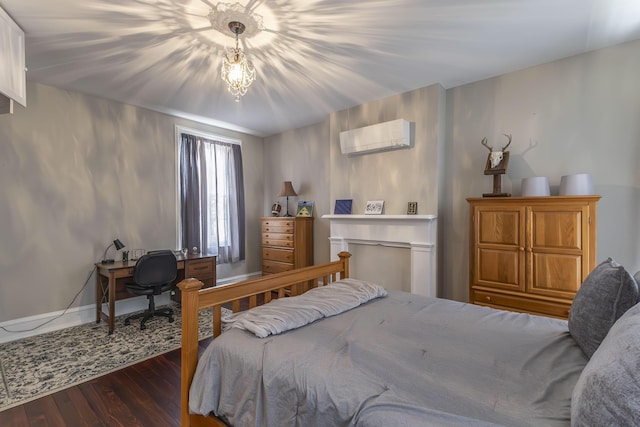 1001 Randolph St, Glasgow, MO 65254 - bedroom with wood finished floors, a wall mounted AC, and an office area