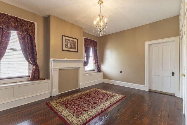 1001 Randolph St, Glasgow, MO 65254 - foyer with a chandelier, dark wood finished floors, and healthy amount of natural light