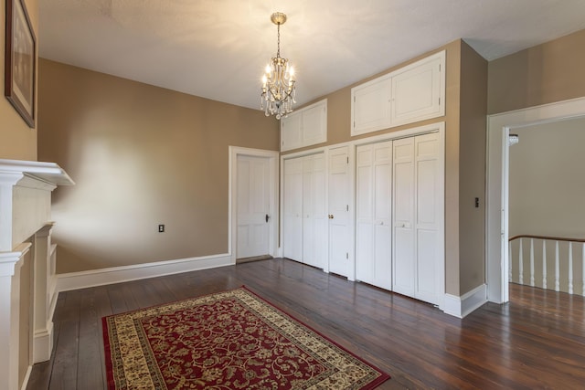 1001 Randolph St, Glasgow, MO 65254 - interior space with a chandelier and dark wood-style flooring