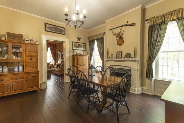1001 Randolph St, Glasgow, MO 65254 - dining space with a chandelier, dark wood-type flooring, a high end fireplace, and ornamental molding