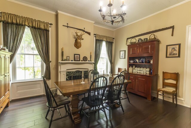 1001 Randolph St, Glasgow, MO 65254 - dining area featuring a chandelier, dark wood-style flooring, and ornamental molding
