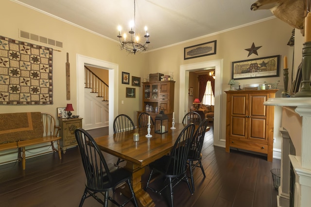 1001 Randolph St, Glasgow, MO 65254 - dining space featuring dark wood-style floors, crown molding, a chandelier, and stairs
