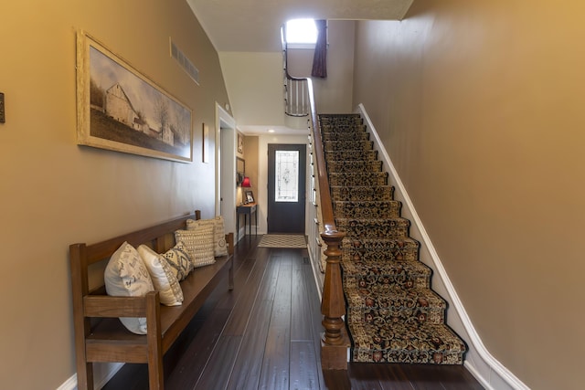 1001 Randolph St, Glasgow, MO 65254 - stairway featuring a towering ceiling and hardwood / wood-style flooring
