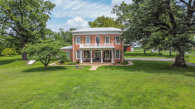1001 Randolph St, Glasgow, MO 65254 - rear view of property featuring covered porch, brick siding, a yard, and a balcony