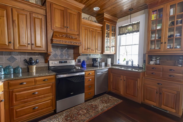 1001 Randolph St, Glasgow, MO 65254 - kitchen featuring appliances with stainless steel finishes, brown cabinets, wood ceiling, dark stone counters, and backsplash