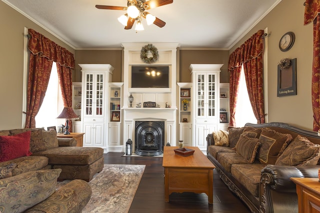 1001 Randolph St, Glasgow, MO 65254 - living area with ceiling fan, plenty of natural light, dark wood-type flooring, crown molding, and a fireplace with flush hearth