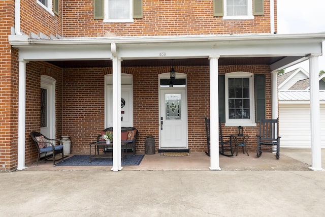 1001 Randolph St, Glasgow, MO 65254 - doorway to property with brick siding and a porch