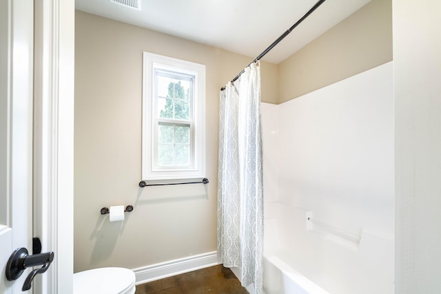 3903 Foxcreek Way, Columbia, MO 65203 - bathroom with toilet and shower / bath combo with shower curtain