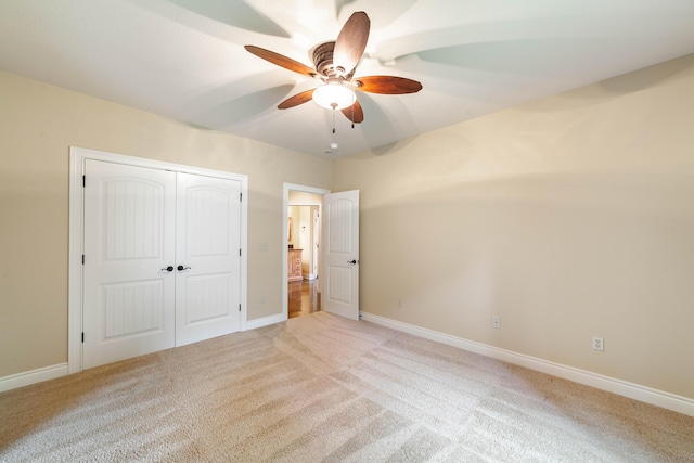 3903 Foxcreek Way, Columbia, MO 65203 - unfurnished bedroom with light carpet, a closet, and ceiling fan