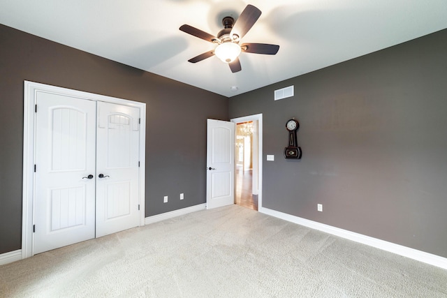 3903 Foxcreek Way, Columbia, MO 65203 - unfurnished bedroom featuring light carpet, a closet, and a ceiling fan
