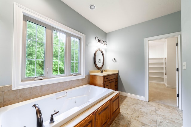3903 Foxcreek Way, Columbia, MO 65203 - bathroom with vanity and a jetted tub