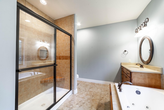3903 Foxcreek Way, Columbia, MO 65203 - bathroom featuring a shower stall, a tub with jets, and vanity