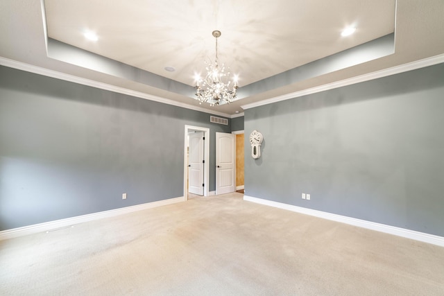 3903 Foxcreek Way, Columbia, MO 65203 - spare room featuring a tray ceiling, a chandelier, carpet flooring, recessed lighting, and ornamental molding