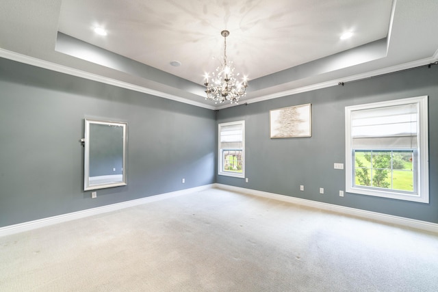 3903 Foxcreek Way, Columbia, MO 65203 - carpeted spare room with a raised ceiling, a chandelier, and ornamental molding