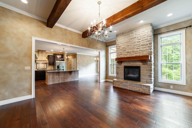 3903 Foxcreek Way, Columbia, MO 65203 - unfurnished living room featuring a chandelier, beamed ceiling, dark wood-style flooring, a fireplace, and crown molding