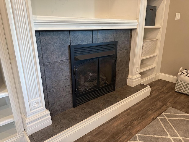 3045 State Rd, Aa, Holts Summit, MO 65043 - detailed view of wood finished floors and a tiled fireplace