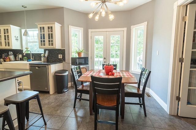 3045 State Rd, Aa, Holts Summit, MO 65043 - dining area with a chandelier, dark tile patterned floors, and french doors