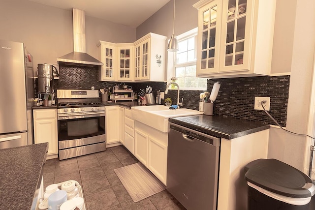 3045 State Rd, Aa, Holts Summit, MO 65043 - kitchen with stainless steel appliances, wall chimney exhaust hood, dark countertops, and backsplash