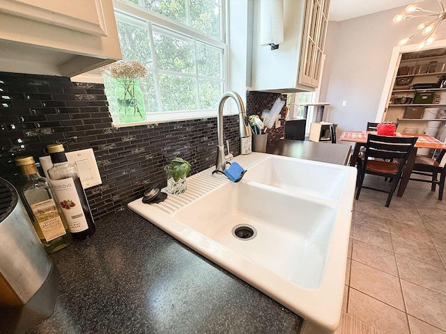 3045 State Rd, Aa, Holts Summit, MO 65043 - kitchen view of backsplash, glass insert cabinets, and white cabinets