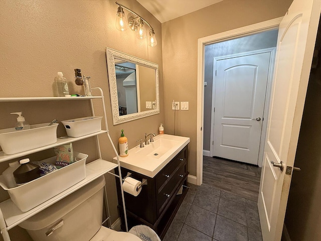 3045 State Rd, Aa, Holts Summit, MO 65043 - half bath featuring vanity, tile patterned floors, and a textured wall