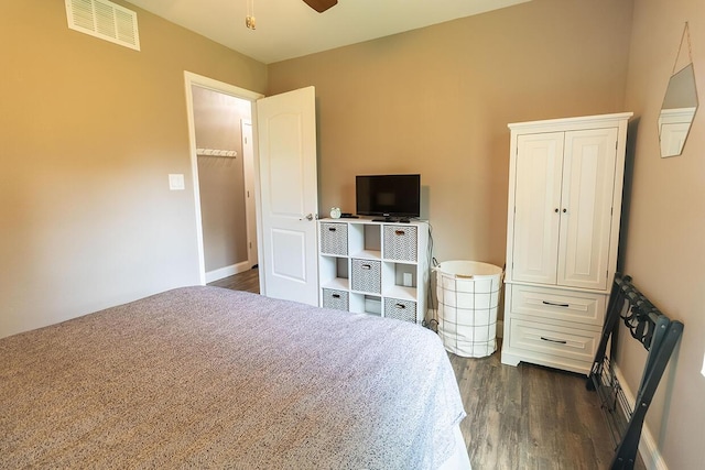 3045 State Rd, Aa, Holts Summit, MO 65043 - bedroom featuring dark wood-style floors and baseboards
