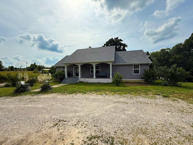 3045 State Rd, Aa, Holts Summit, MO 65043 - view of front of house featuring a porch and a front yard