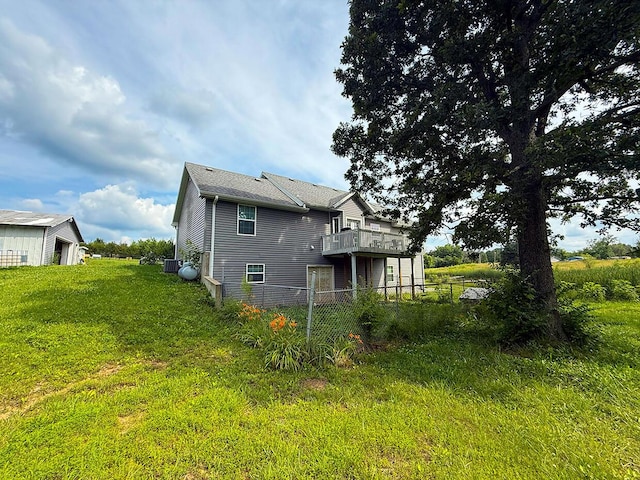 3045 State Rd, Aa, Holts Summit, MO 65043 - rear view of house with a deck