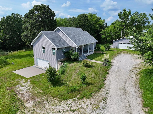 3045 State Rd, Aa, Holts Summit, MO 65043 - view of front of property featuring a porch, a front yard, driveway, and an outdoor structure