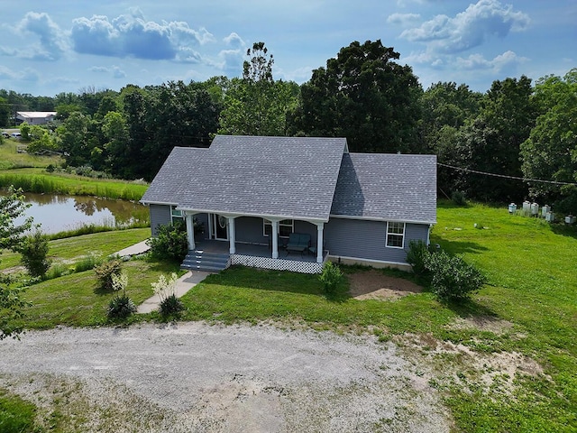 3045 State Rd, Aa, Holts Summit, MO 65043 - view of front of home featuring a porch, a front yard, a water view, and a shingled roof