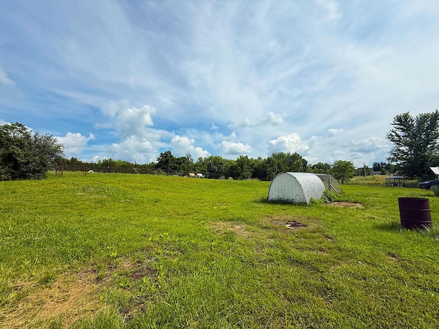 3045 State Rd, Aa, Holts Summit, MO 65043 - view of green lawn featuring a rural view