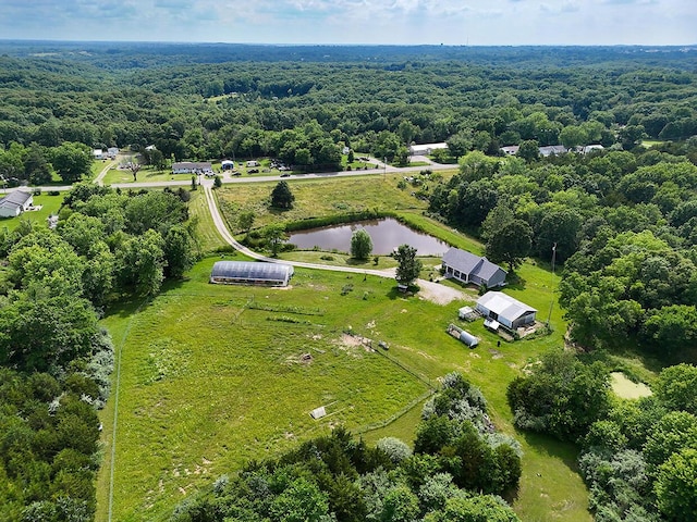 3045 State Rd, Aa, Holts Summit, MO 65043 - drone / aerial view of a heavily wooded area and a nearby body of water
