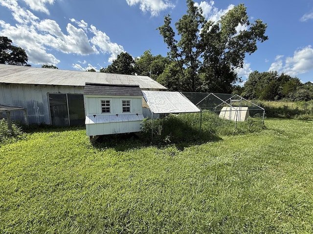 3045 State Rd, Aa, Holts Summit, MO 65043 - view of side of home featuring a yard