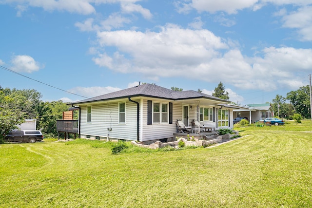 4741 E N Rte E, Columbia, MO 65202 - back of house with a lawn and roof with shingles