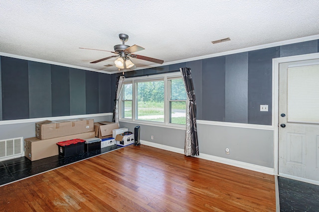 4741 E N Rte E, Columbia, MO 65202 - empty room featuring a ceiling fan, wood finished floors, a textured ceiling, and crown molding