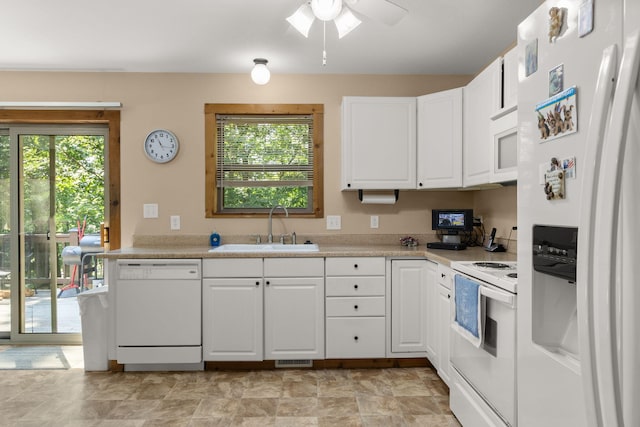 28 Hamilton Way, Sunrise Beach, MO 65079 - kitchen with white appliances, light countertops, white cabinetry, and ceiling fan
