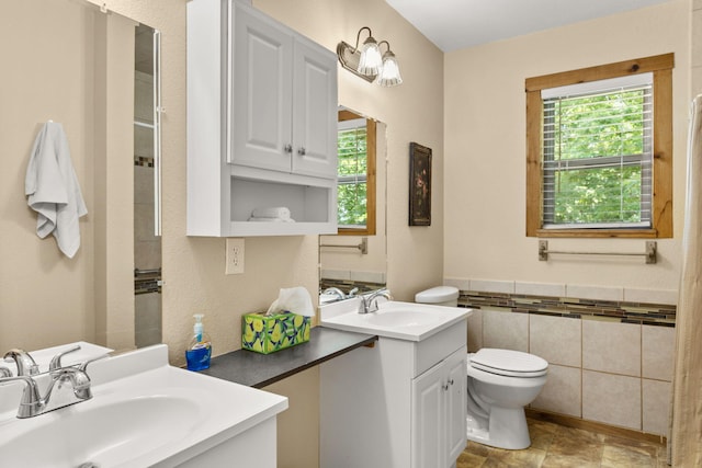 28 Hamilton Way, Sunrise Beach, MO 65079 - bathroom with vanity, tile walls, a shower, and a wainscoted wall