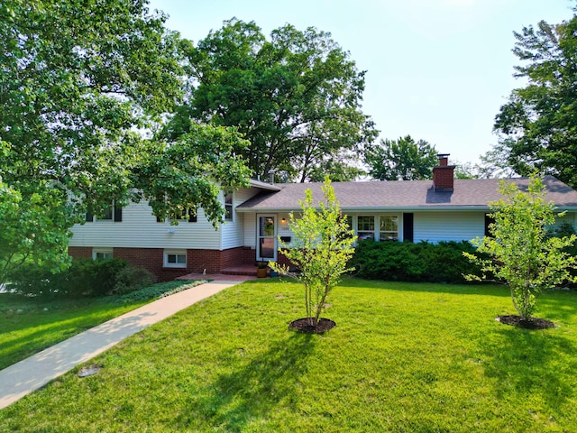 1000 Yale Dr, Columbia, MO 65203 - tri-level home featuring a front lawn and a chimney
