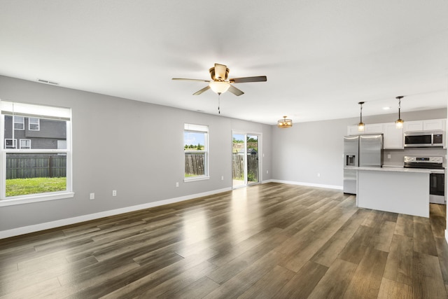 3306 Tuscany, Columbia, MO 65202 - unfurnished living room with a ceiling fan and dark wood-style floors