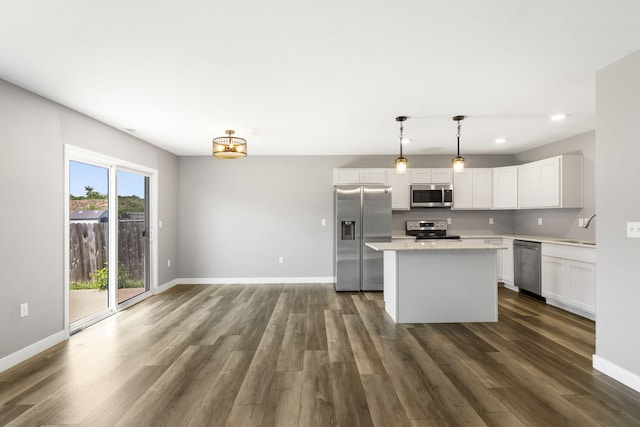 3306 Tuscany, Columbia, MO 65202 - kitchen with stainless steel appliances, a kitchen island, white cabinetry, dark wood-style floors, and recessed lighting